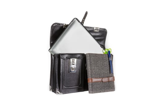 Black retro leather schoolbag with notebook on background photo