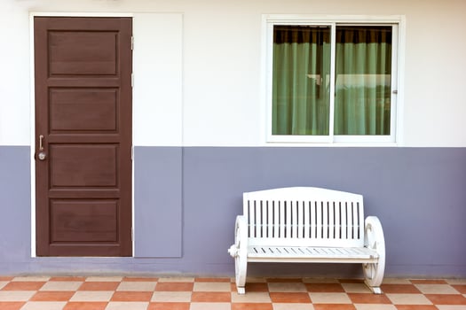 white bench with window and door photo