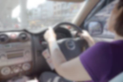 Woman drive car blur background of Illustration,Abstract Blurred photo