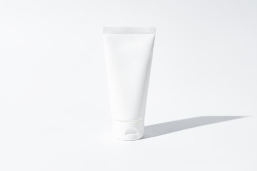 mockup of white squeeze bottle plastic tube for branding of medicine or cosmetics - cream, gel, skin care, toothpaste. Cosmetic bottle container on a white background with shadows. Minimalism photo
