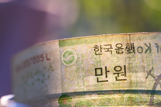 South Korea banknotes in glass jar. photo