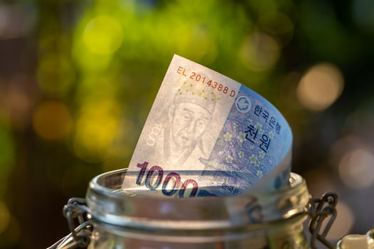 South Korea banknotes in glass jar. photo