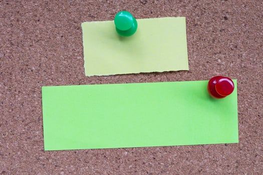Stick note and pinned to a cork notice board. Copy space. photo