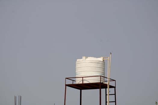 Plastic Water Tank on Top of Indian Village House. photo