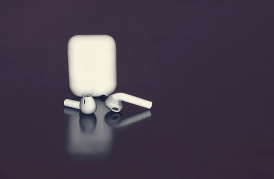 Isolated Air pod in dark background.White color Air Pod. photo