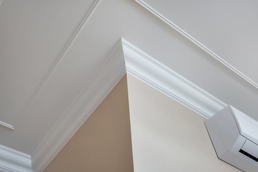Detail of corner ceiling cornice with intricate crown molding. photo