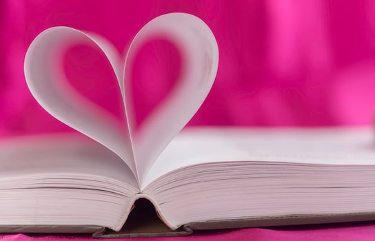 Open book with heart shape photo
