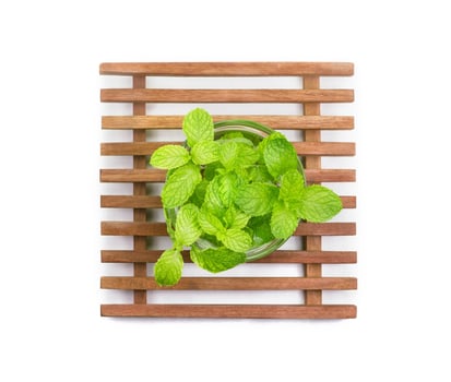 Mint in the transparent glass bowl isolated on white background photo