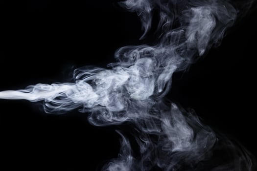 Abstract  powder or smoke isolated on black background photo