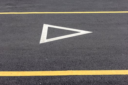 Give way sign on asphalt road photo