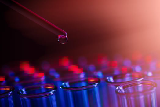 Test tube row. Concept of medical or science laboratory, liquid drop droplet with dropper in blue red tone background, close up, macro photography picture. photo