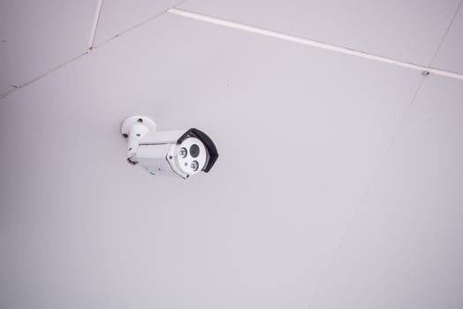 Security CCTV camera on the wall photo