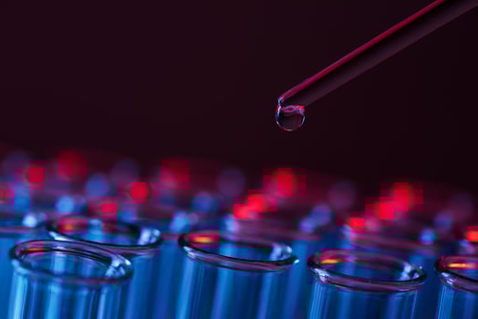 Test tube row. Concept of medical or science laboratory, liquid drop droplet with dropper in blue tone background, close up, micro photography picture. photo