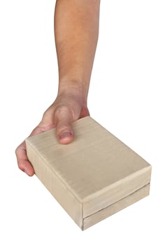 Hand holding paper box give gift isolated on white background,clipping path photo