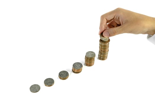 businessman holding coin with coins stacks on white background photo