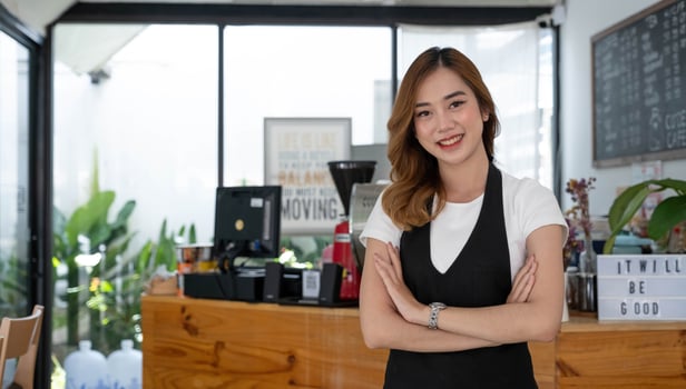 Portrait of Startup successful small business owner in coffee shop.handsome man barista cafe owner. SME entrepreneur seller business concept. photo