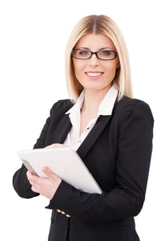 Businesswoman with digital tablet. Confident mature businesswoman working on digital tablet and smiling while standing isolated on white photo