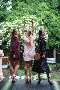 Three girls posing on camera photo