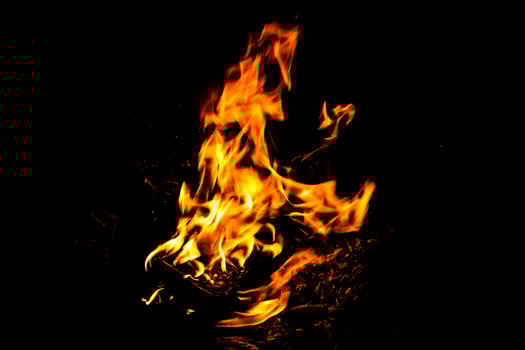 Fire flame texture. Burning material backdrop. Burn effect pattern. Blaze and torch wallpaper. Heat and haze backdrop. photo