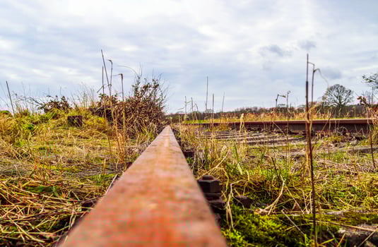 Multiple railroad tracks with junctions at a railway station in a perspective and birds view photo