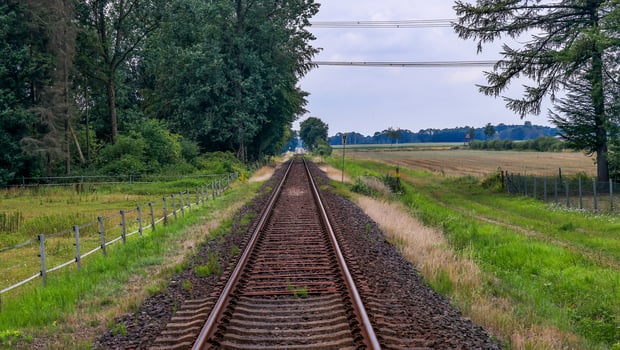 Multiple railroad tracks with junctions at a railway station in a perspective and birds view photo