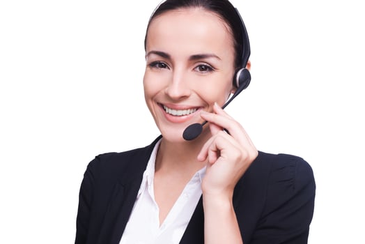 How may I help you Beautiful young woman in headset smiling and looking at camera while isolated on white photo