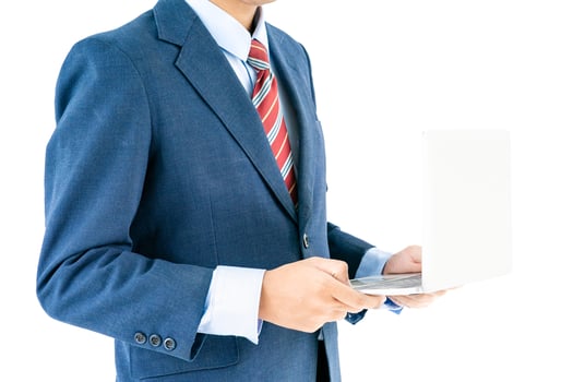 Businessman in suit holding a laptop photo