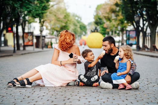 beautiful young family with ice cream photo