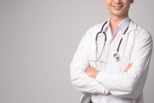 Portrait of male confident doctor over white background studio, healthcare and Medical technology concept. photo