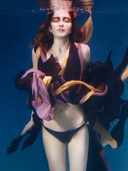 beautiful artistic young woman in dress dancing underwater. Mermaid, harvest, dance, fairy concept photo