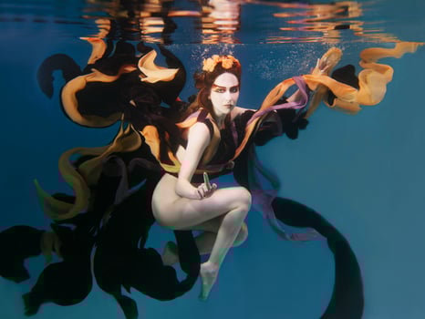beautiful artistic young woman in dress dancing underwater. Mermaid, harvest, dance, fairy concept photo
