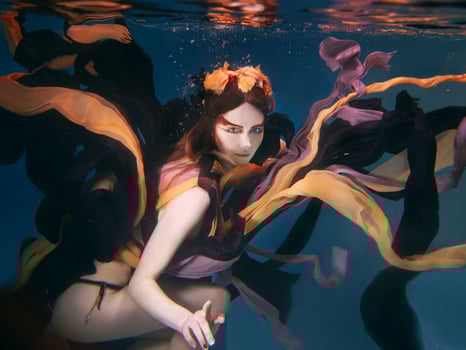 beautiful artistic young woman in dress dancing underwater. Mermaid, harvest, dance, fairy concept photo