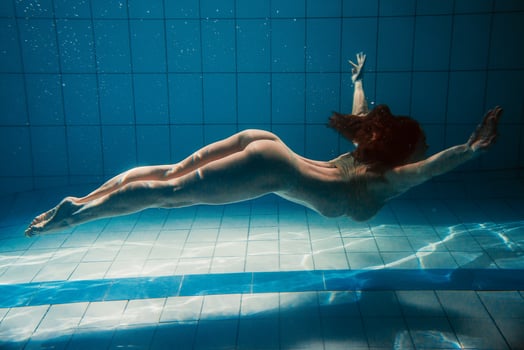 athletic sport woman underwater in the swimming pool photo