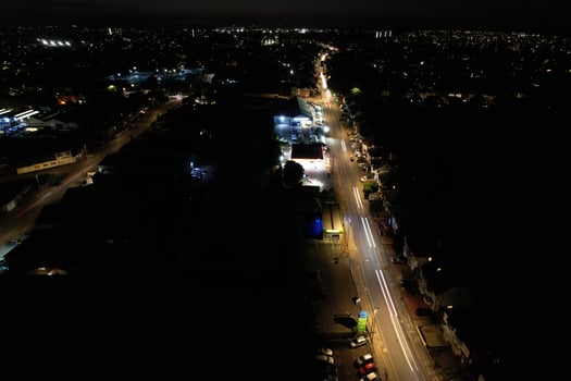 Night Aerial View of Illuminated British City. Drone's Footage of Luton Town of England at Night photo