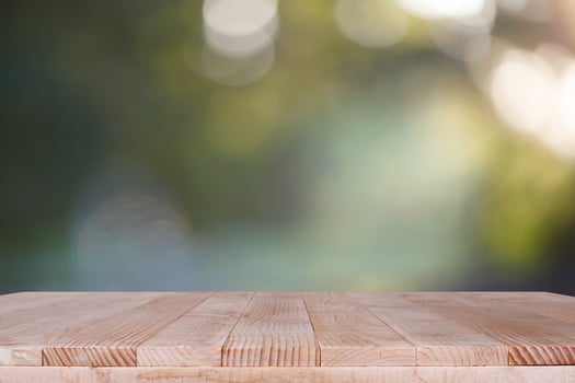 Wood table top on bokeh green background - can be used for montage or display your products photo