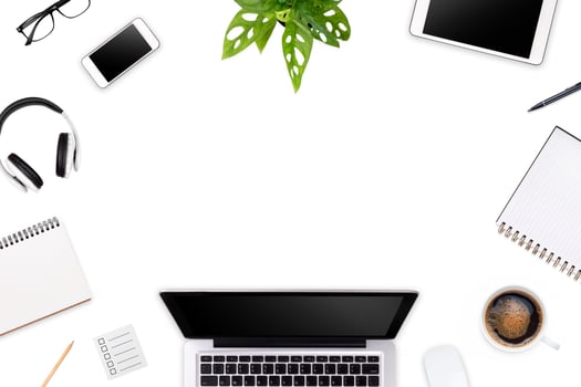 Modern workspace with laptop tablet, smartphone and coffee cup copy space on color background. Top view. Flat lay style. photo