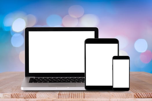 Front view of the laptop, tablet pc, smartphone is on the work table with bokeh background photo