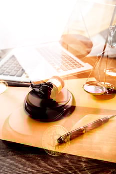 Business and lawyers discussing contract papers with brass scale on desk in office. Law, legal services, advice, justice and law concept picture with film grain effect photo