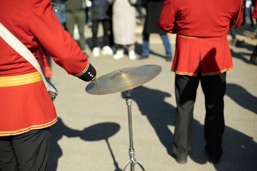 Drummer at parade in red clothes. Drumming. photo
