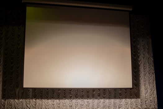 Auditorium. White screen for image projection. photo