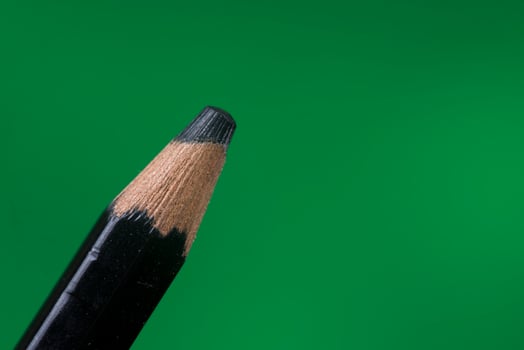 tip detail of color pencils on a green background photo