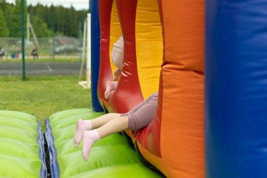 Child on obstacle course. Children's entertainment area. photo