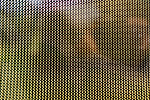 Mesh texture on glass. Shooting window. Small cage. photo
