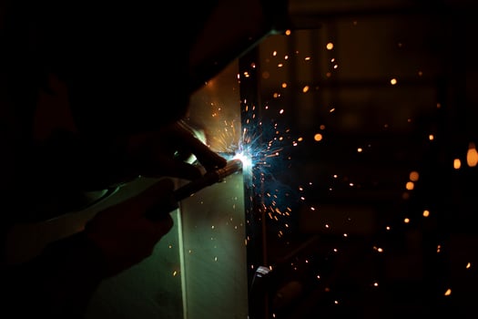 Welding work. High temperature. Hot steel. Metal welding. Production details. photo