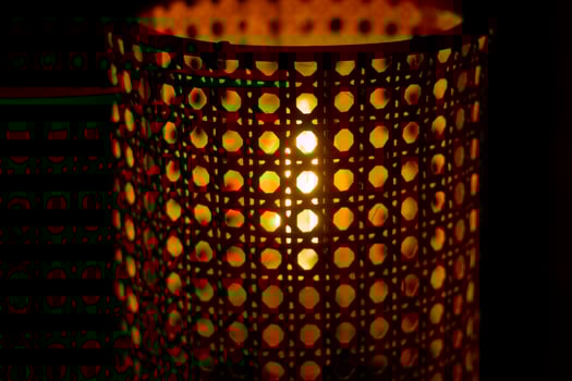 Wooden lamp. Lampshade for incandescent lamp. Light in dark. photo