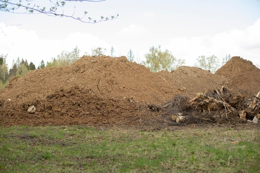 Sand on construction site. Building material is piled up in heap. photo