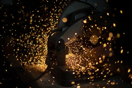 Sparks in dark. Cutting steel. Industrial equipment. photo