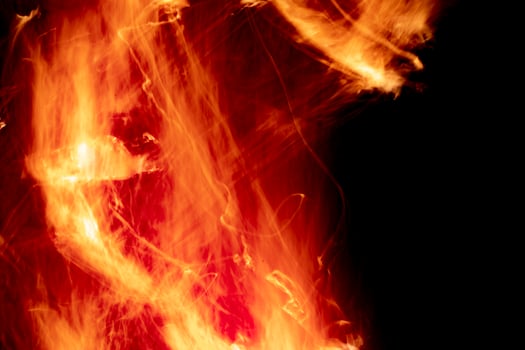 Texture of fire. Flames in night. Burning firewood. photo