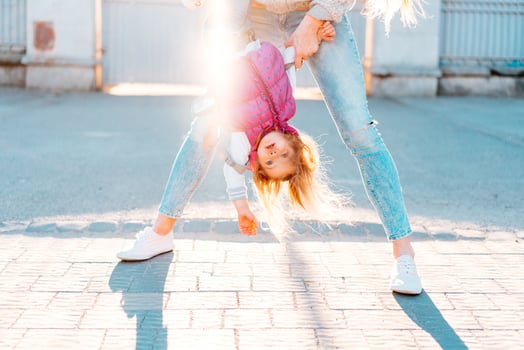 Mom and girl playing, having fun photo