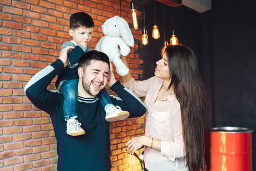 young family having fun at home photo